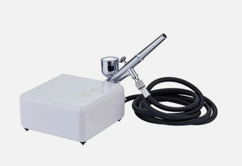 ماكنة رش شوكلاتة قوالب